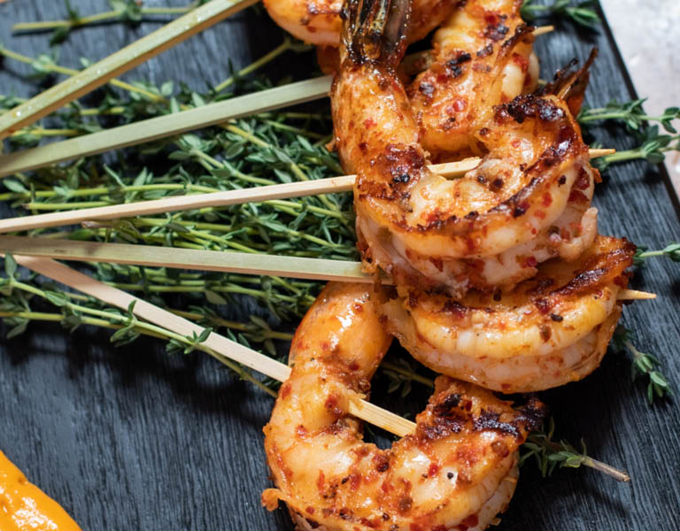 Plate of skewered shrimp